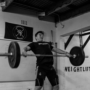 man pulling bar up in motion